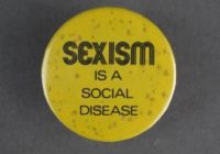 A yellow badge with black text that says sexism is a social disease.