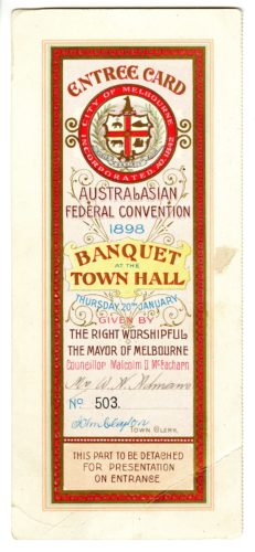 A cream and red invidiation DL sized. There is a red cross at the top and in the centre red block text that reads Banquet Town Hall.