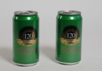 Two green and gold beer cans standing side by side. There is a logo in the centre that reads 125 in celebration of 125 years of the United Trades and Labor Council of SA.