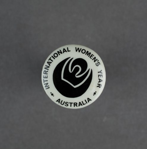 International Women's Year badge in black and white