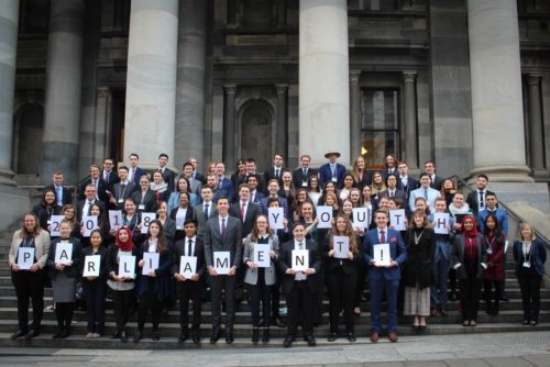 A group of young people standing on the steps of South Australian parliament.